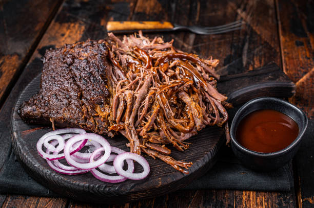 istock Traditional barbecue wagyu pulled beef on wooden board. Wooden background. Top view 1456253343