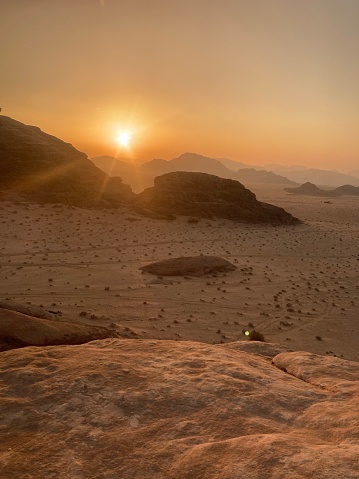 view on the sunset from the top of a rock in wadi rum desert, jordan