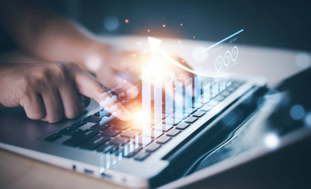 istock Changes in new planning, Hand using laptop with arrow business, start new year concept digital trends, industry and business trend, strategy, investment, business planning and graphs, crypto currency 1456259492