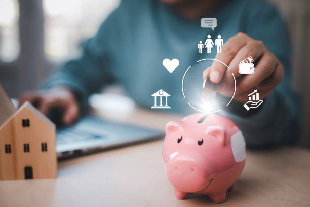 Budget and Saving money concept for financial accounting,Woman hand putting coin in piggy bank, financial plan and Money saving ideas, business finance and investment, life and family planning. stock photo
