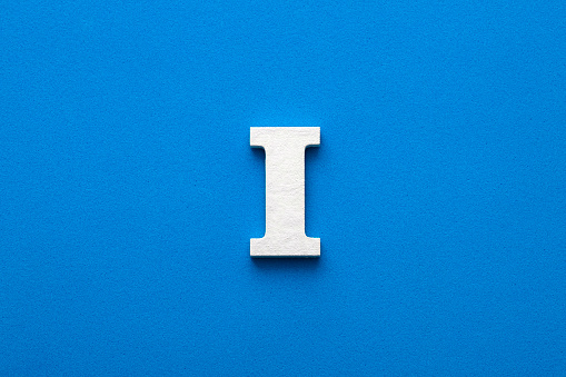 Letter I uppercase - White wood font on blue foamy background