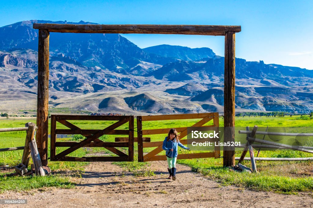 Girl on a ranch in Wyoming rural scenic Child in rural Wyoming 6-7 Years Stock Photo