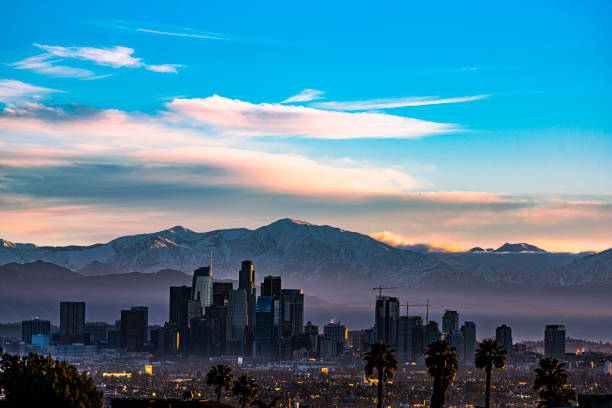 istock Snow Capped Mountains Sit Behind Los Angeles Skyline 1456265334