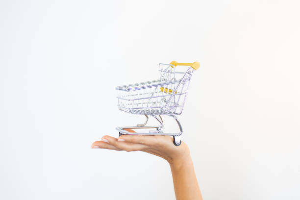 istock Hand Holding Shopping Cart Ecommerce 1456265345