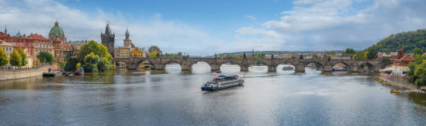 Panoramic view of Charles Bridhe and Vltava River - Prague, Czech Republic Panoramic view of Charles Bridhe and Vltava River - Prague, Czech Republic vltava river stock pictures, royalty-free photos & images