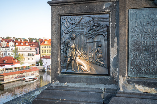 Plaque under the Statue of John of Nepomuk at Charles Bridge - Prague, Czech Republic