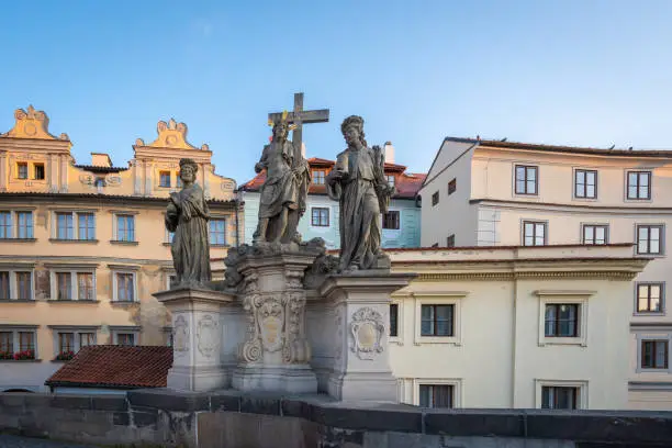 Statue of Holy Savior with Cosmas and Damian at Charles Bridge - Prague, Czech Republic