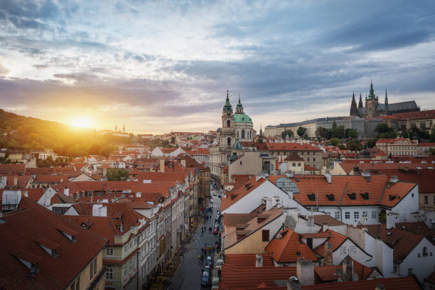 Aerial view of Mala Strana at sunset with St. Nicholas Church and Prague Castle - Prague, Czech Republic Aerial view of Mala Strana at sunset with St. Nicholas Church and Prague Castle - Prague, Czech Republic st nicholas church prague stock pictures, royalty-free photos & images