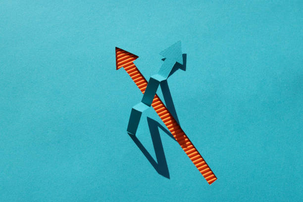 Arrow shapes on paper background​​​ foto