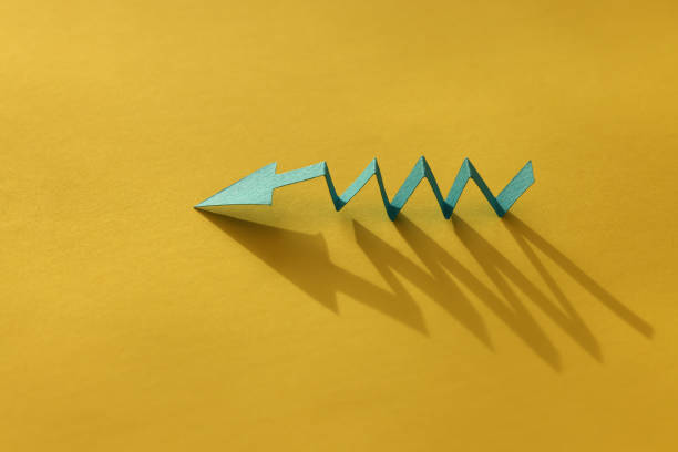 istock Arrow shapes on paper background 1456271913