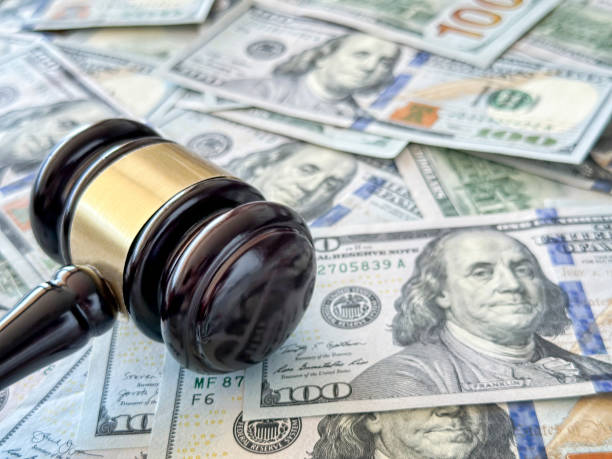 istock Judge gavel and dollar roll 1456275005