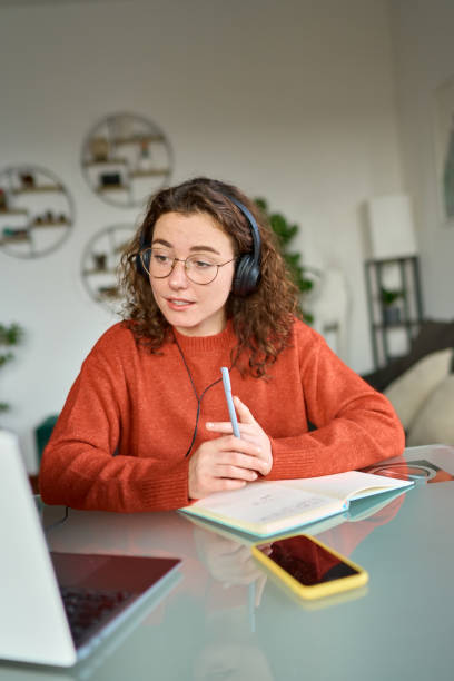 istock Young woman student elearning or having remote virtual meeting at home. 1456275184