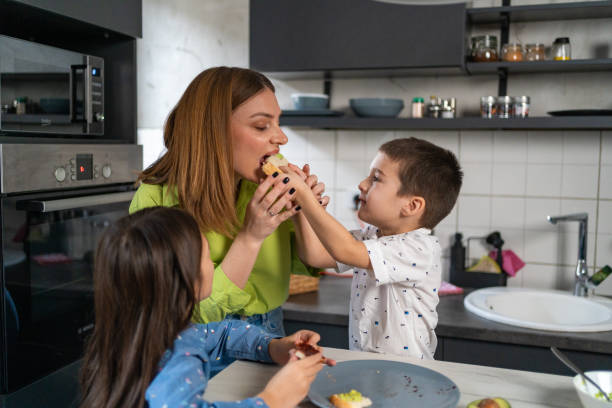 istock Family eating breakfast in kitchen at home 1456276870
