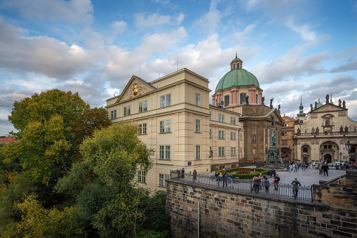 Prague, Czechia - Sep 25, 2019: Krizovnicke Square view with Charles Bridge Museum and St. Francis of Assisi Church (St Francis Seraph) - Prague, Czech Republic