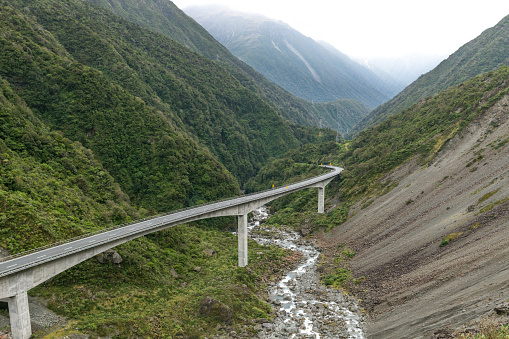 Road in Arthur pass between high mountains, South island, New Zealand