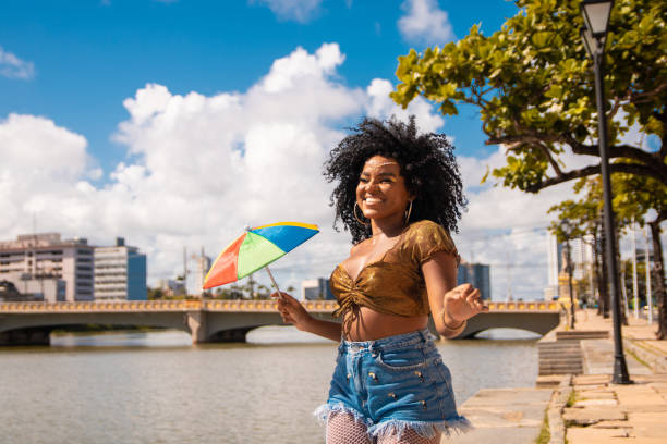 dancer holding a frevo umbrella - rio carnival imagens e fotografias de stock