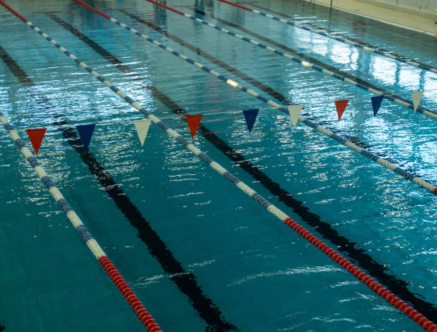 istock Swimming pool for swimming competitions. Empty Paths of a competitive swimming pool. Active swimming lessons. 1456283404