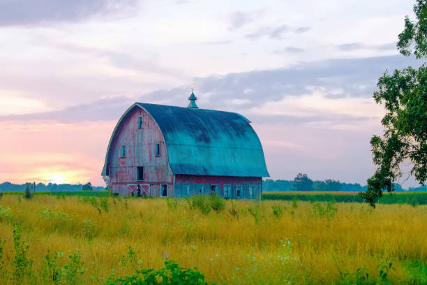 istock Old weathered Red Barn at sunrise-Howard County, Indiana 1456290363