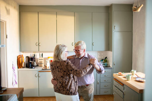 istock Senior couple dancing at home 1456290666