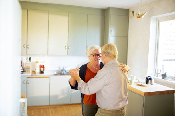 istock Senior couple dancing at home 1456291460