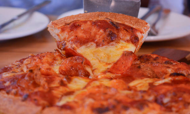 istock pizza; cheese; pepperoni; tasty; slice; food 1456294480