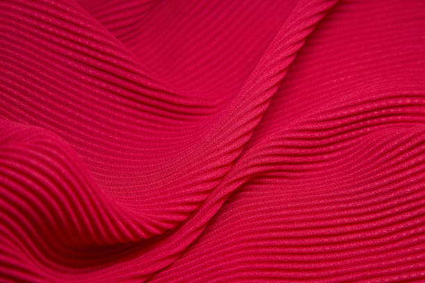 istock Pink fabric background. Pink cloth waves background texture. Pink fabric cloth textile material. 1456300056