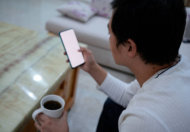 istock Men surf the web on the couch 1456304920