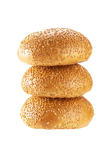istock Stacked hamburger buns with sesame seeds isolated on white background 1456306738