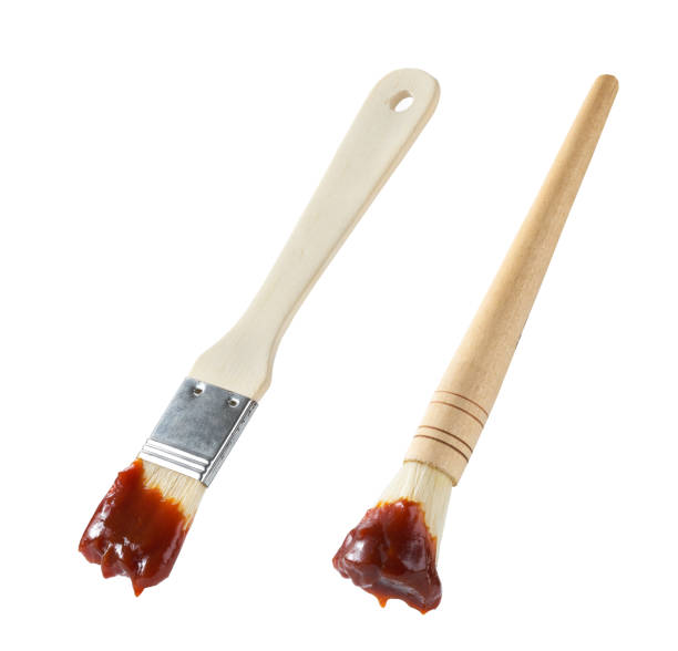 Barbecue brush with a wooden handle isolated on white background. bbq sauce and brush. stock photo