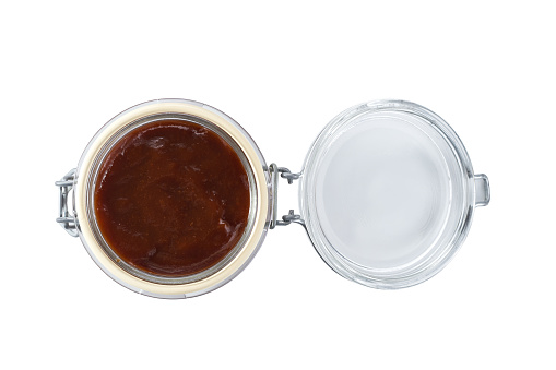 glass jar of bbq sauce  isolated on white background.
