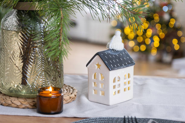 istock Festive Christmas decor in white kitchen, festive breakfast, white scandi interior. The figure of a cozy house ion the set table. New Year, mood, cozy home. Copy space 1456314207
