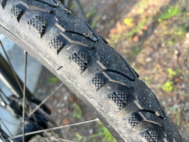 istock Bicycle wheel on the ground in the park. 1456316616
