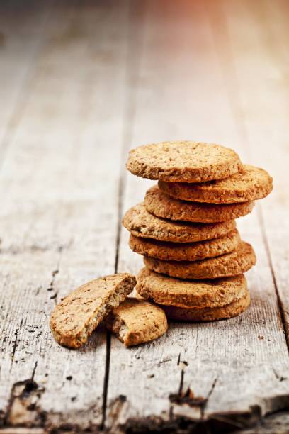 istock Fresh oat cookies on rustic wooden table background. 1456319894