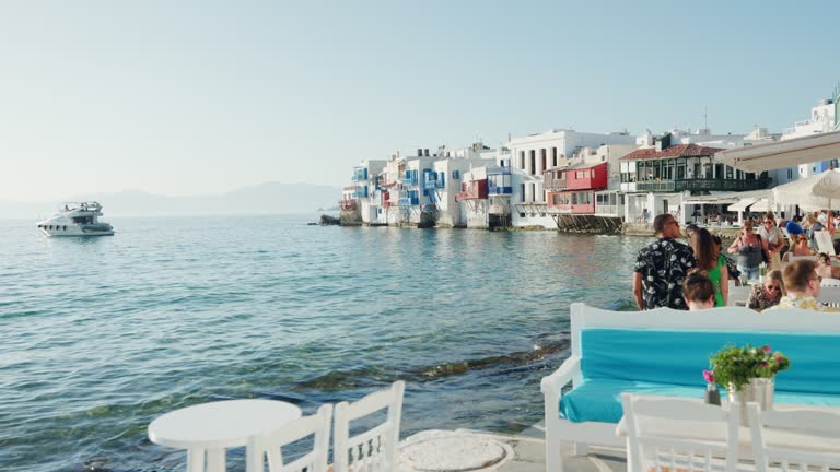 Relaxing at an outdoor restaurant in Little Venice, Mykonos, Greece