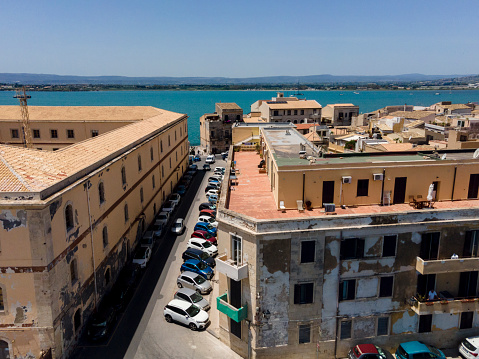 An aerial image of Syracuse, Sicily during the summer picturing buildings in the town
