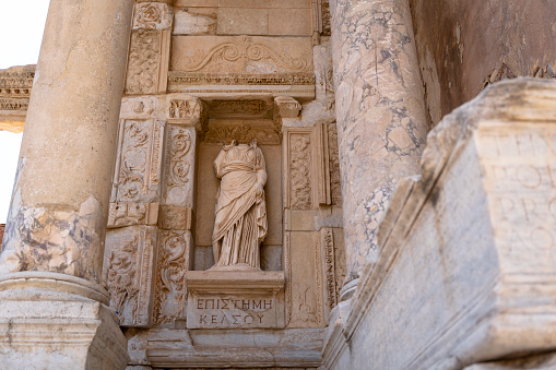 An image of a statue with a missing head in ancient ruins in Ephesus, Turkey