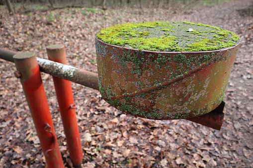 Counterweight of a metal barrier in the woods