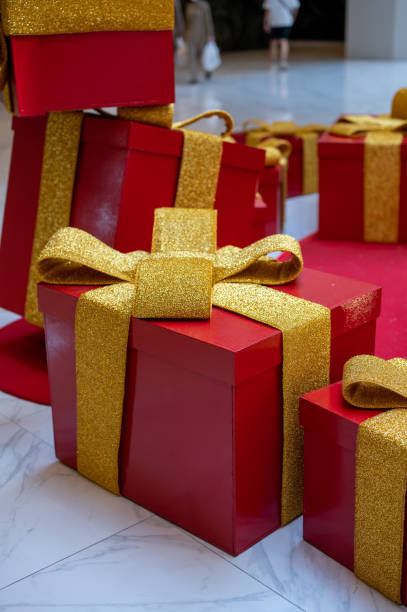 istock Christmas gift boxes with evergreen garland 1456324336