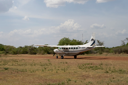 Serengeti, Tanzania - October 14th, 2022: A light airplane in an airstrip in the Serengeti nature reserve, Tanzania.