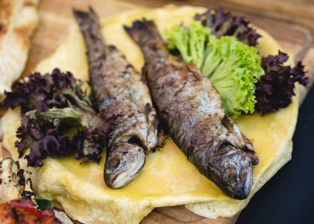 istock delicious baked fish with salad 1456331497