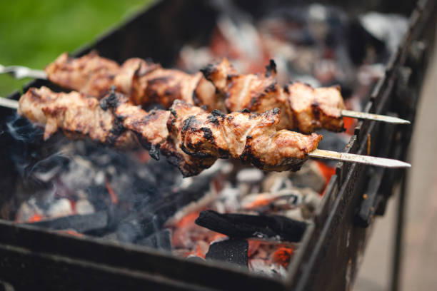 istock delicious and fragrant meat, skewers on grill 1456332192