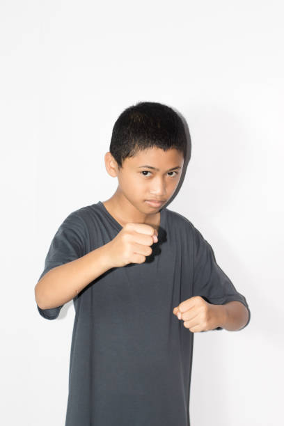 boy fight with fighting pose boy fight with fighting pose schoolyard fight stock pictures, royalty-free photos & images