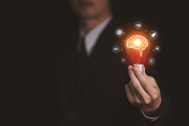 istock Businessman hand hold virtual lightbulb with brainstorm. New ideas inspiration and innovation technology concept. Science and communication concept. 1456333921