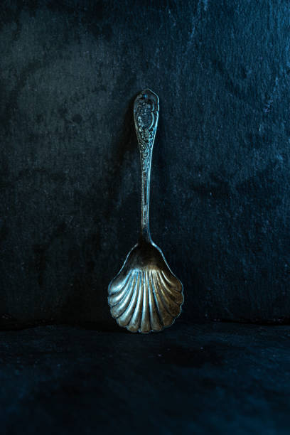 Old silver spoon. Dessert spoon made of silver. Spoon for caviar. Old silver spoon. Dessert spoon made of silver. Spoon for caviar. Vertical frame. baby spoon stock pictures, royalty-free photos & images