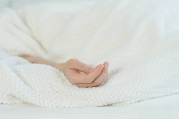 istock The woman's hand in bed 1456335946