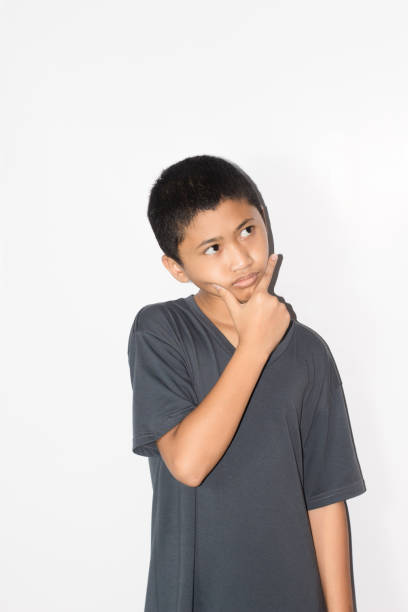 istock portrait Asian boy on isolated white background 1456341890