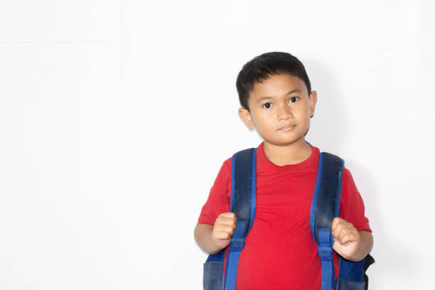 Asian boy wearing casual uniform school isolated on white background