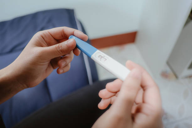 istock Woman asian taking a pregnancy test. 1456342723