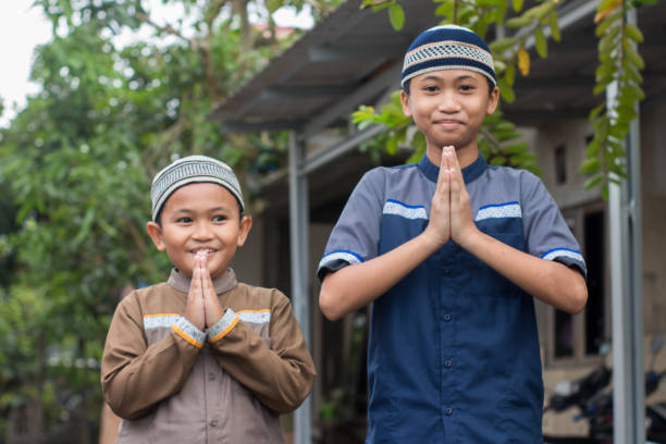 istock asian muslim boy Eid Mubarak greeting 1456343177