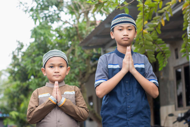 istock asian muslim boy Eid Mubarak greeting 1456343244